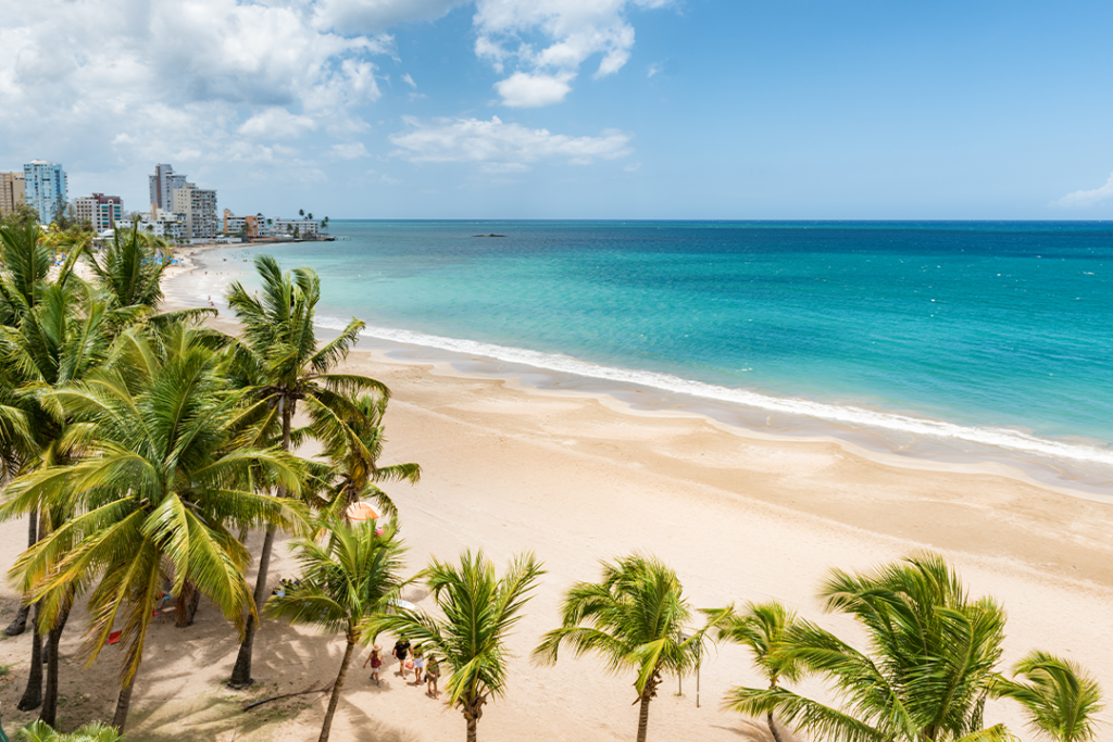 Beach travel Caribbean vacation landscape of Puerto Rico background. Isla Verde in San Juan, Latin America island.